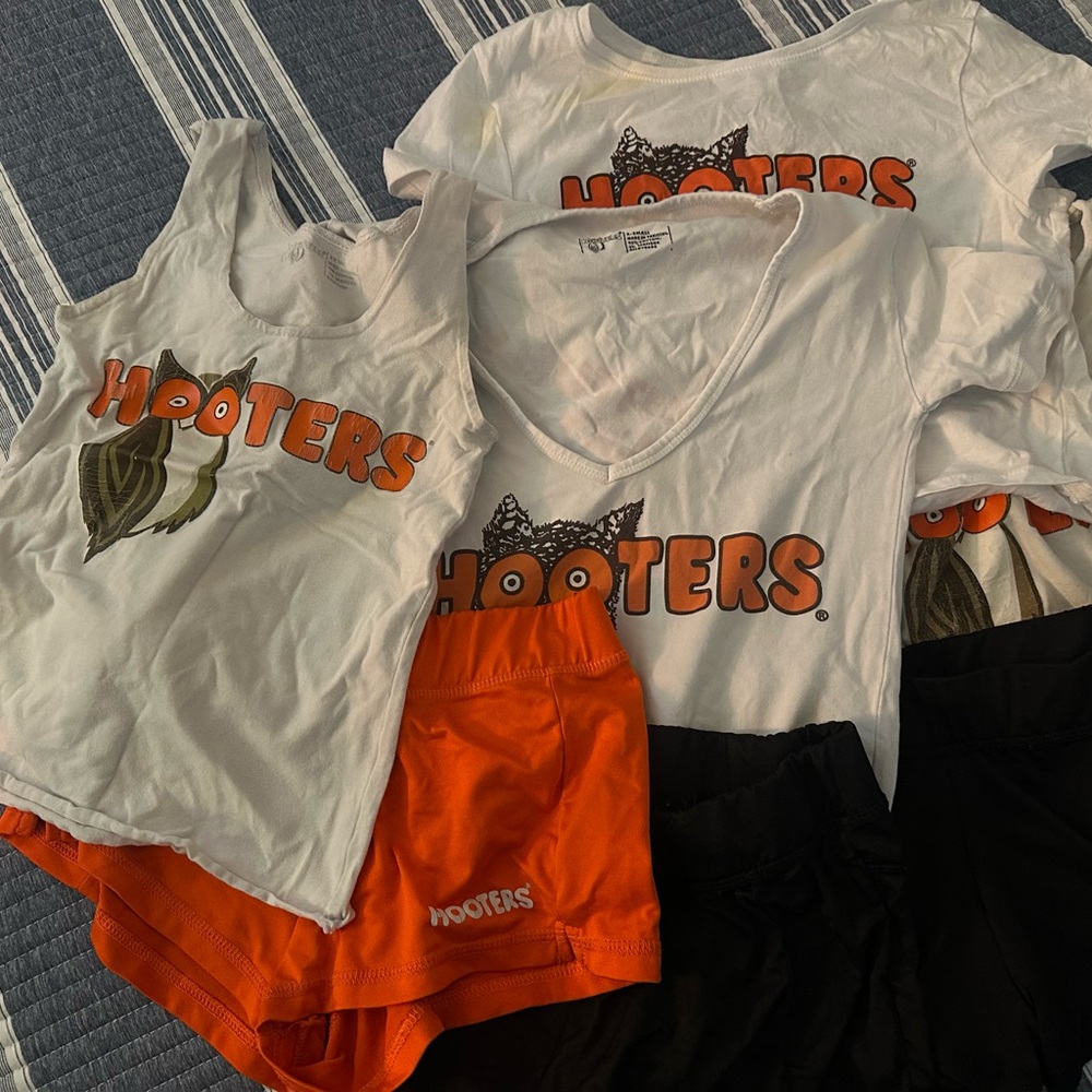 Original Hooters White and Black uniform set. Various sized tops and bottoms.